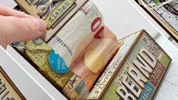 Geldrollbox mit herausziehbaren Geldscheinen als Geschenk für den Chef.